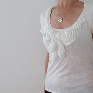 Press Ecru cap sleeve fabric flower decor top